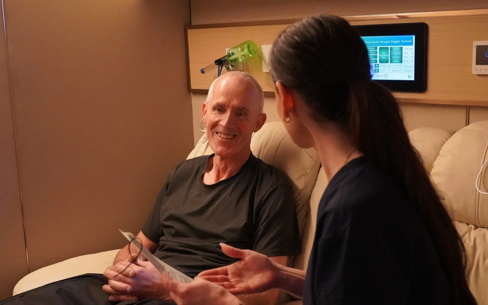 Client and practitioner inside the hyperbaric chamber at My BioHealth